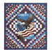 The completed Trip Around The World Panel Quilt colored in patriotic red, white, and blue fabrics from the Stars & Stripes 13 collection, isolated on a white background.