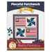 Front cover of the project featuring the completed July Pieceful Patchwork project, colored in cream, red, blue, and teal fabrics from the Americana collection by Lori Holt for Riley Blake Designs. 