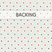 White fabric with small red and blue stars, labeled backing at the top.