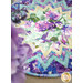 An aqua and purple quilted table mat featuring a hummingbird among purple flowers and geometric patterns.