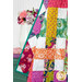A close up on the draped quilt, showing flow and form as well as fabric and top quilting details.