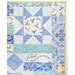 A close up on the patchwork of the quilt demonstrating fabric color and pattern details, as well as top quilting effects.
