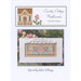 Front of the April Mini Village pattern by Country Cottage Needleworks, featuring a stitched scene of a village in April.