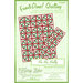 Cover image for a quilting pattern titled Ho Ho Holly, featuring red and green holly designs on a light background.