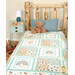 A shot of the quilt draped over a cabin bed, staged with a teddy bear and ABC blocks on a coordinating aqua nightstand.