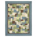 The Easy as ABC and 123 Quilt - Lodge Life quilt featuring a patchwork design in tones from nature like blue, green, and brown, isolated on a white background.