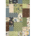 A close up of the center patchwork, showcasing the animal and outdoorsy prints in blue, green, cream, and brown.