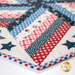 A super stylized close up on one point of the topper, demonstrating fabric color and print details.
