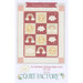 A patchwork baby quilt featuring suns, rainbows, and clouds in pastel colors with a title Sunny Skies.