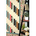 A shot of the right side of the quilt, demonstrating fabric, piecing, border, and binding details.