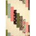 A close up on the center stairstep patchwork, demonstrating fabric, piecing, and stitching details.