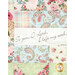 A super close up on the patchwork of the quilt, highlighting a panel piece that reads, 