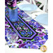 A stylized shot of the runner, demonstrating vibrant color details on the pansy themed fabric; coordinating glassware, flowers, and plates complement the project.