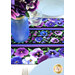 A close up on the center of the runner, demonstrating vibrant color details on the pansy themed fabric; coordinating glassware, flowers, and plates complement the project.