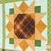 A super close up on one of the patchwork sunflowers, demonstrating fabric prints, colors, and top quilting details.