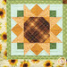 A head on shot of one of the patchwork sunflowers, demonstrating fabric prints, colors, and top quilting details.