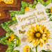 A super close up on the center of the topper, focusing on the middle print with a sunflower and the phrase 