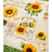 A super close up on a placemat, showing detail on the sunflower themed newsprint pattern.
