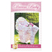 9-patch pink and white baby quilt with pink rose flowers in a bassinet.