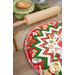A shot of the outer edge of the table topper staged next to a rolling pin and small baked pie.