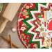 A top-down shot of the table topper staged next to a rolling pin and Christmas candy.
