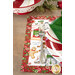 A shot of one of the placemats staged on a table and set with a peppermint plate, coordinating green cloth napkins, and silverware.