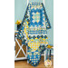 The finished Quilt hung over a white ladder to show form and drape, staged in front of an aqua-paneled wall with coordinating decor and flowers in the background.