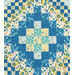 A head-on shot of the diamond center of the quilt, showcasing the yellow, white, navy, and blue floral fabrics.