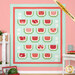 The completed Watermelon Patchwork quilt in colorful aqua, pink, red, and green fabrics featuring watermelon slices, displayed against a pink wall staged with coordinating decor and watermelon slices.