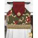 A close up on the top section of the towel, showing details on the bell fabric as well as the fabric button.