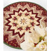A shot of the center of the topper, showcasing the kaleidoscopic effect featuring a cream fabric with Christmas bells.