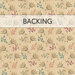 A tan swatch of fabric with a tossed leaf motif in beige, camel, teal, purple, and coral. A banner at the top reads 