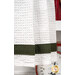 A super close up on the pine green herringbone fabric used for the complementary stripe at the bottom of the towel.