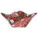 The completed bowl cozy colored in red and green fabrics from the Berry & Pine collection by Moda Fabrics, isolated on a white background.