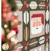 Close-up of a festive quilt featuring a Santa face among holiday-themed patterns on a green background.