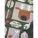 A quilt featuring a reindeer head and various geometric shapes with floral patterns on a green background.
