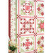 A stylized close up of the quilt, demonstrating fabric color and print details.