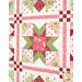 A super close up on one of the blocks, demonstrating details on the patchwork, fabric, and top quilting details.