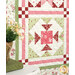 A super close up on one of the blocks, demonstrating details on the patchwork, fabric, and top quilting details.