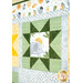 A close up on one of the green quilting stars with an elephant in the middle with text that reads, 