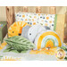 A shot of the completed Minky pillows from the Sunny Safari collection, featuring a leaf, lion head, elephant head, and rainbow, staged on a cabin bed with a coordinating Sunny Safari pillow and patchwork quilt.