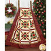 The completed Christmas in Coeur d'Alene Quilt, colored in red, green, cream, and white fabrics from the Stof 2025 collection, draped over a rustic quilt ladder and staged with coordinating Christmas decor.
