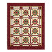 The completed Christmas in Coeur d'Alene Quilt, colored in red, green, cream, and white fabrics from the Stof 2025 collection, isolated on a white background.