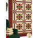 A stylized shot of the quilt, demonstrating the patchwork layout as coordinating decor peek into frame from the left side.