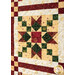 A super close up on one of the star point and chain blocks, showing color and print details of the fabrics as well as top quilting effects.