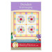 Front cover of the project featuring the completed Dresden Wall Hanging, colored in bright yellow, white, and rainbow fabrics from the Nana Mae 8 collection.