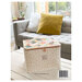 The back of the pattern with the finished sewing case displayed in a living room on a white table.