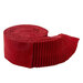 A red rolie polie loosely undone, isolated on a white background.