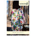 The front of the Rojas Quilt Pattern, showing the finished quilt draped over a rustic wooden structure.