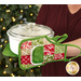 A model demonstrates the use of the Apron Hot Pads, holding a white casserole dish.